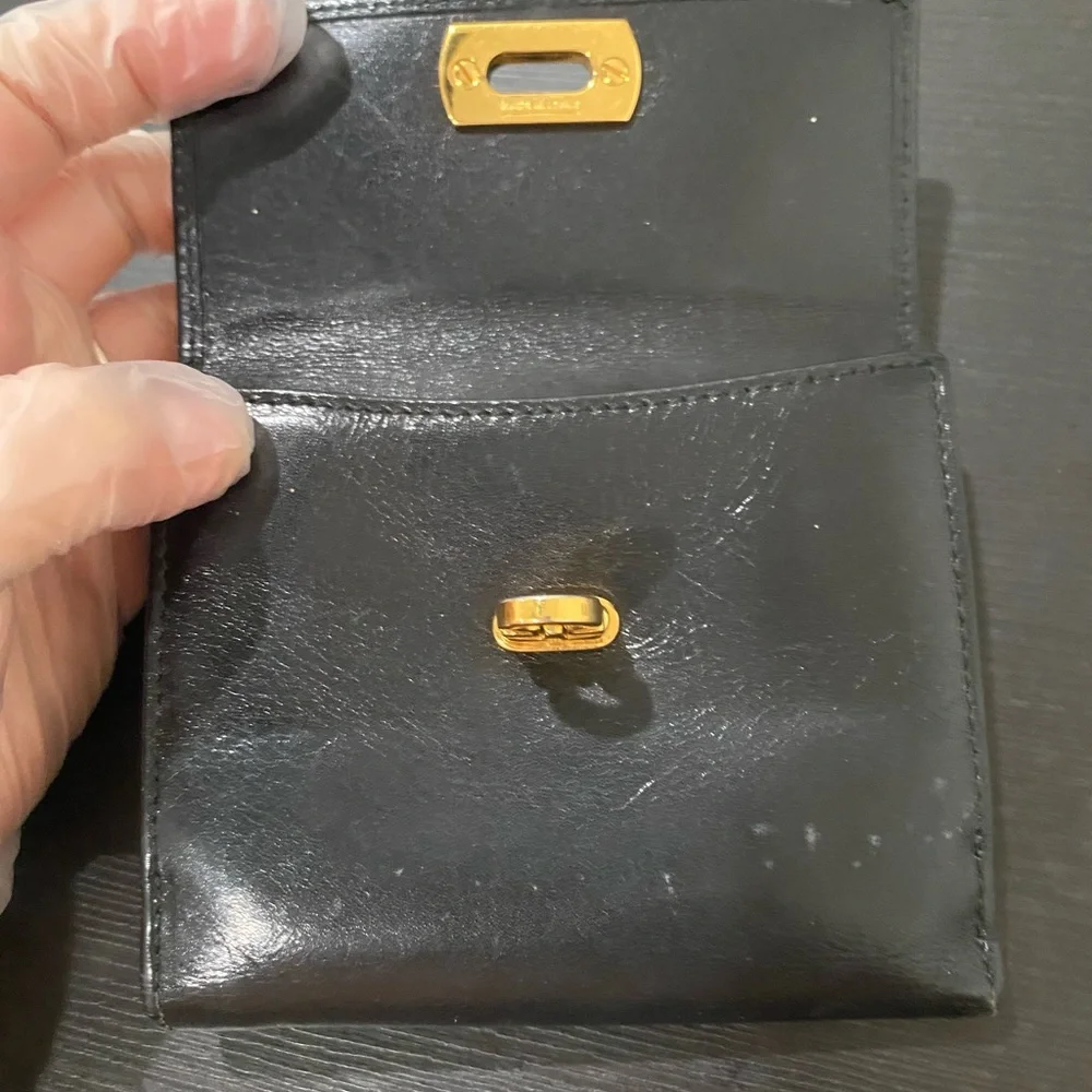 Authentic Ferragamo black leather trifold wallet gold with callouts